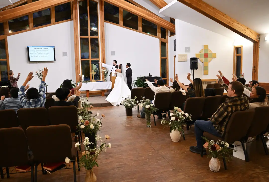 Center aisle of the sanctuary, with chairs and string lights
