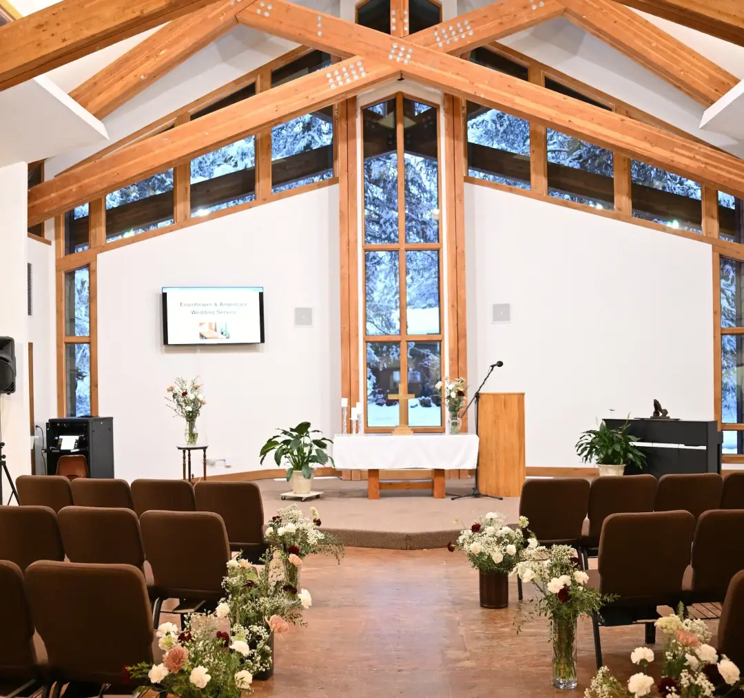 Sanctuary looking toward the windows, with a piano in the foreground